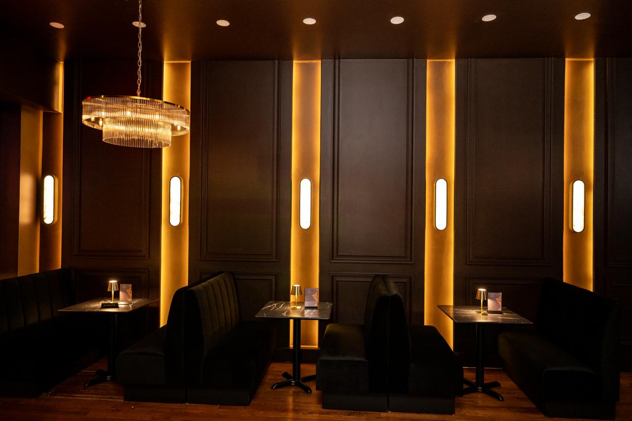 AURA long banquette and ambient lighting rhythm
